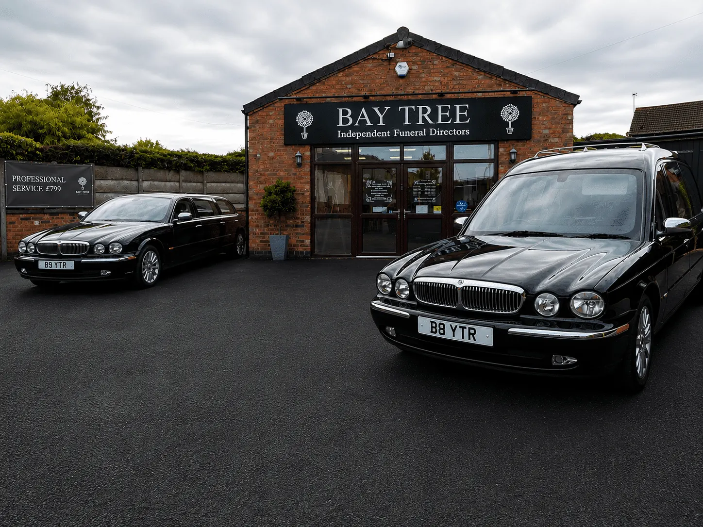 Bay Tree Funeral Directors in Blaby, Leicester, with the funeral home and vehicles outside