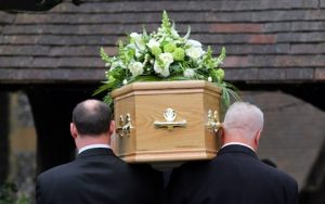 funeral directors with coffin 