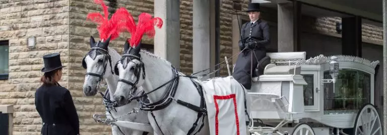 Traditional horse drawn funeral procession Leicester